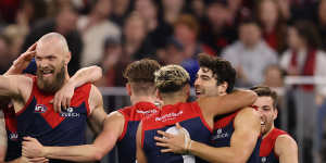 Max Gawn celebrates with teammates after scoring in Melbourne’s thumping win over Geelong.