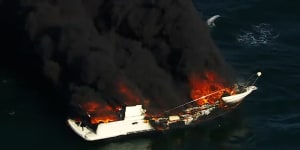 Two men rescued from flaming boat on Port Phillip Bay