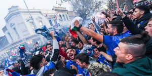 Italian soccer fans celebrate in Lygon Street.