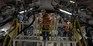 A worker inside the massive boring machine which is about to start tunnelling under Sydney Harbour.