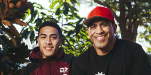 John Hopoate with son Lehi at their home in Dee Why.