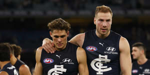 Harry McKay and Charlie Curnow walk off the field.