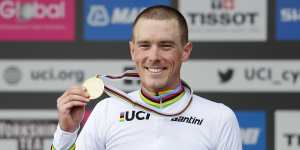 Australian Rohan Dennis enjoys the spoils of victory in the individual world time trial.