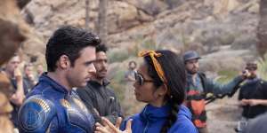 Richard Madden and director Chloé Zhao on the set of Eternals.