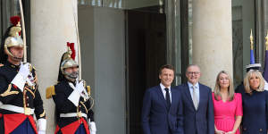 French President Emmanuel Macron (left) and his wife,Brigitte Macron (right),greet Australian Prime Minister Anthony Albanese and his partner Jodie Haydon at the Elysee Palace in Paris on Friday.