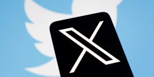 Musk’s new logo,X,crosses out Twitter’s blue bird. 