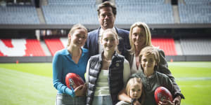 AFL chief Gillon McLachlan announces his plans to vacate the role,supported by his wife Laura and children Edie,14,Cleo,12,Sidney,8 and Luna 5.