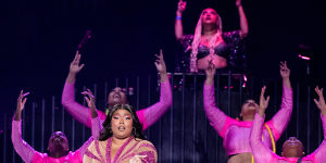Lizzo performing with her backup dancers in California in 2022.