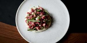 Steak tartare with radish,coastal rocket and and creme fraiche.