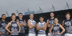 The Cats’ AFL and AFLW players in the club’s Indigenous jumpers.