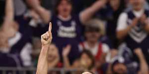 Alex Pearce points to the sky after kicking the clutch goal against the Magpies.