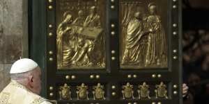 Pope Francis opens the Holy Door to mark the opening of the 2025 Catholic Holy Year,or Jubilee,in St Peter’s Basilica,at the Vatican on Christmas Eve.