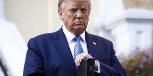 President Donald Trump holds a Bible as he visits outside St. John’s Church across Lafayette Park from the White House Monday,June 1,2020,in Washington. Part of the church was set on fire during protests on Sunday night. (AP Photo/Patrick Semansky)
