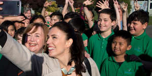 New Zealand Labour Party leader Jacinda Ardern,front right,takes a selfie with school children in Christchurch.