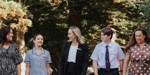 Rebecca King and her daughter Madison,principal Gabie Stojanovski and Joanna McNamara with her son Billy,12.