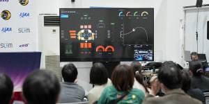 Journalists watch a live streaming of the pinpoint moon landing operation by the Smart Lander for Investigating Moon (SLIM) spacecraft at JAXA’s Sagamihara Campus Saturday,Jan. 20,2024,in Sagamihara near Tokyo. (AP Photo/Eugene Hoshiko)