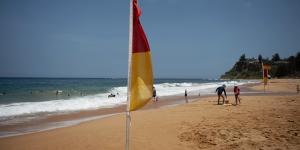 Swimmers have been urged to stay between the red and yellow flags.