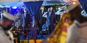 Prince Charles watches as the British royal standard is folded after it is lowered in Bridgetown,Barbados,on Tuesday.