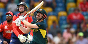 Travis Head smashes a six in Australia’s 36-run win against England in Barbados on Sunday.