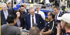 Then opposition leader Anthony Albanese visits the Brisbane factory of Tritium in April 2022,during the election campaign. 