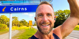 Lachlan Spark finally reaches Cairns after completing 222 days of consecutive half-marathons,beginning in Hobart.