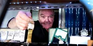 Rob Herron has owned and operated Crows Nest Pawn Shop for 35 years. He says business has been slow since the pandemic,but he still sees people come in struggling to pay their household bills. 