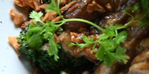 Porterhouse steak with mushroom duxelles,broccolini and peppercorn.
