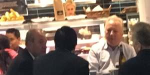 Daryl Maguire (left of image facing),unknown male 1 referred to as Ron (white shirt),Michael Hawatt (right,back to camera),Charbel Demian (left,back to camera). All males seated at the Cafe Noir 233 Castlereagh Street,Sydney. 