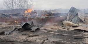 Smoke and flame rise from the debris of a privet house in the aftermath of Russian shelling outside Kyiv,Ukraine,on Thursday.