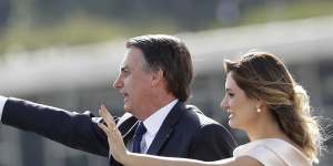 Brazil's new President Jair Bolsonaro,accompanied by his wife Michelle Bolsonaro,at the swearing in ceremony.