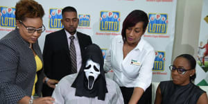 Lottery winner shows up in Scream mask to claim million-dollar prize