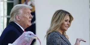 Donald and Melania Trump walk away after the US President pardoned two Thanksgiving turkeys on Tuesday.