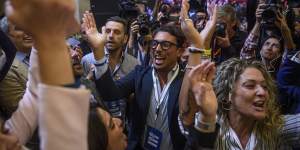 Fratelli d’Italia (Brothers of Italy) supporters celebrate after Giorgia Meloni’s appearance at the party headquarters in Rome. 