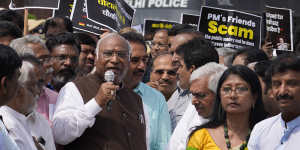 Congress party president Mallikarjun Kharge,centre,with other opposition lawmakers demanding an investigation into alleged accounting fraud and stock manipulation by the Adani Group.