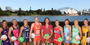 West (centre) with players from each of the Super Netball teams.