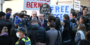 Bernie Finn was at state parliament with his supporters on Tuesday,but did not attend the Liberal party room meeting.