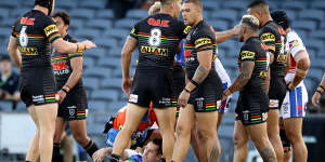 Mitchell Pearce lies injured on the field during the Knights'round-three clash against the Panthers at Campbelltown Stadium on Sunday.