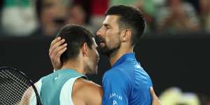 Novak Djokovic embraces Carlos Alcaraz after their quarter-final.