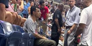 US Open semi-final halted as climate protester glues feet to ground