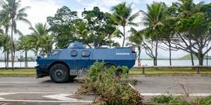A Gendarmerie armoured vehicle drives past the filtering roadblock set up on the bays,Promenade Pierre Vernier,in Noumea.