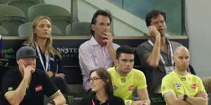 Andrew Dillon and Gillon McLachlan watch close-up a Collingwood-Brisbane game during the 2021 COVID year.