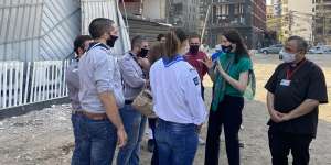 Australian ambassador to Lebanon Rebekah Grindlay briefs volunteers near the site of the massive explosion that rocked Beirut in August.