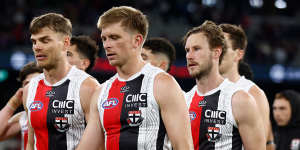 St Kilda players trudge off their ground following their loss to Melbourne.