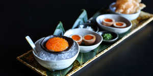 Chuuka's roe service with house-marinated trout roe,cashew cream,shallots,chives,tea eggs and potato rice crackers.