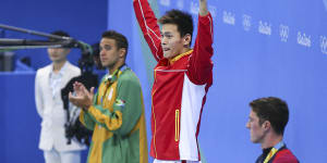 Sun Yang celebrates his Rio victory over Chad Le Clos (left).