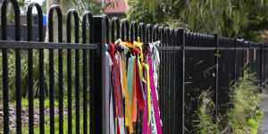 Ribbons attached to the fence at Beaumaris Primary School in support of childhood victim survivors of historical sexual abuse.