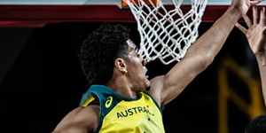 Australian Boomers guard Josh Green (number six) attempts to block Nigeria’s Caleb Agada.