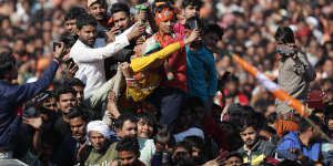 Supporters gather at an election rally addressed by Uttar Pradesh Chief Minister Yogi Adityanath and Indian Prime Minister Narendra Modi ahead of state elections in Kasganj,Uttar Pradesh,India.