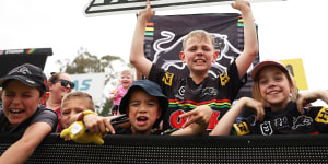 Young Panthers fans watch their idols at a grand final training session this week.