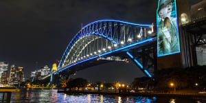 John Bradfield,the chief engineer of the Sydney Harbour Bridge,face is illuminated on the bridge’s pylons to celebrate its 90th birthday. Bradfield imagined the bridge would become a symbol lit up in colours and fireworks. 
